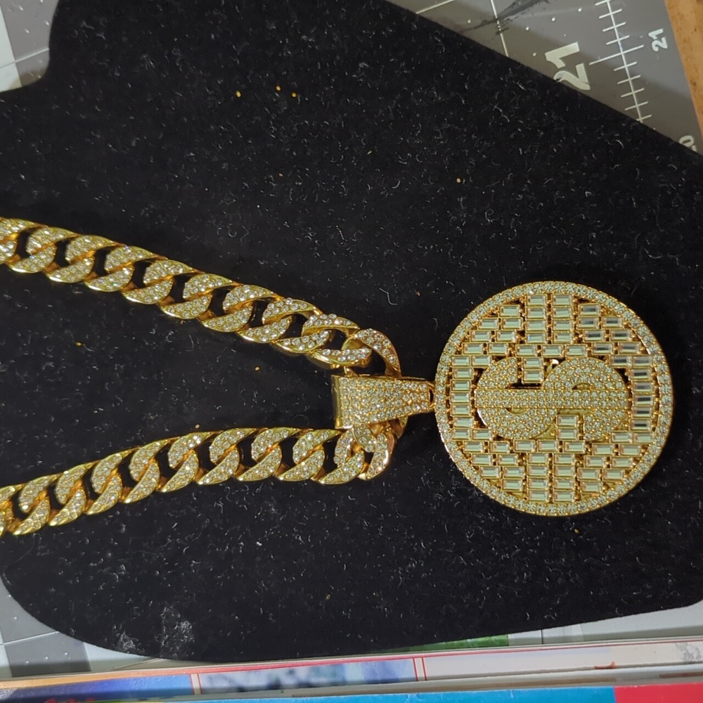 Iced out money sign and chain